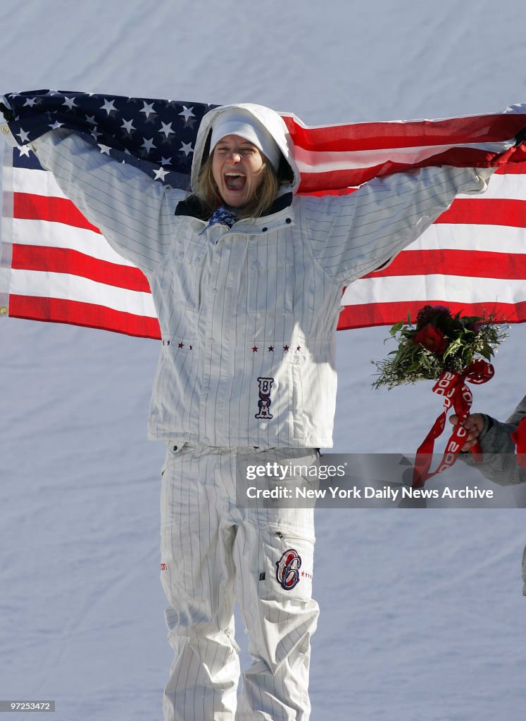 Hannah Teter of the U.S. celebrates winning the gold medal i