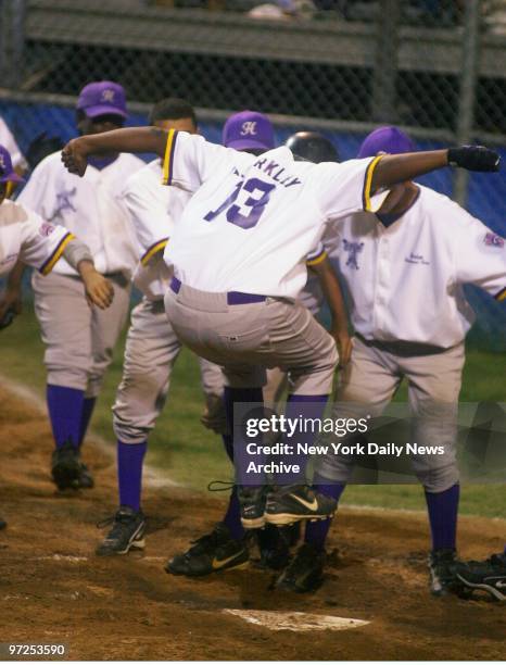 Harlem Little League's Alibay Barkley jumps onto home plate after hitting a two-run homer in the fourth inning against the Bethlehem, Pa., team at...