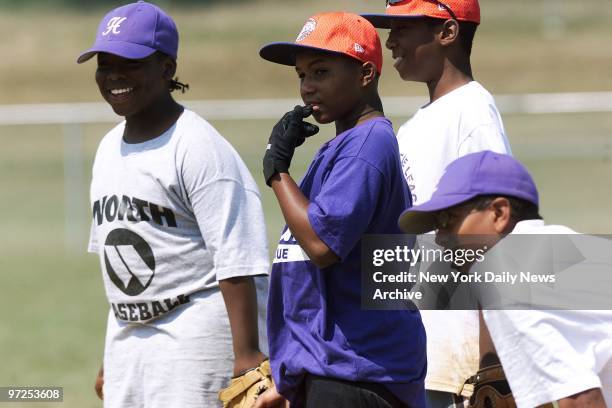 Harlem players Dominique Brown-Jiles, Spencer White, Peter Kidd and Julian McWilliams are on hand at a practice session for tomorrow's game against...