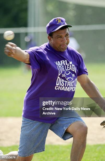Harlem's manager Morris McWilliams pitching batting practice during a warmup session for tonight's regional tournament game in Bristol, Conn. Harlem...
