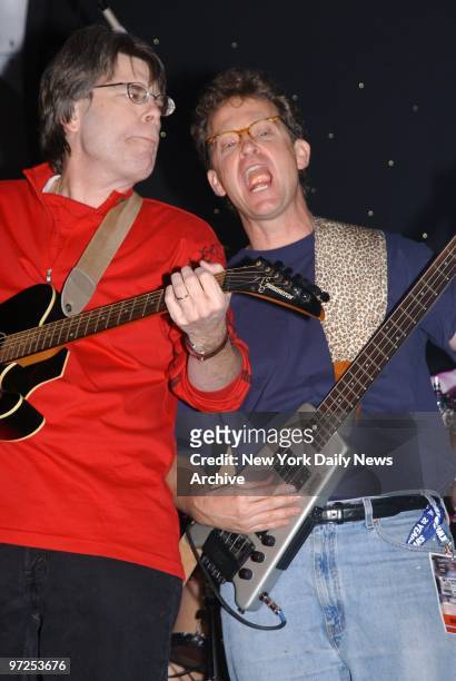 Authors Stephen King and Ridley Pearson play with the Rock Bottom Remainders, a band made up of famous authors, at The World in Times Square, to...