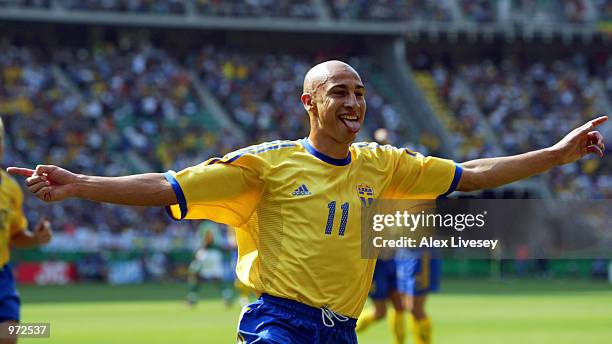 Henrik Larsson of Sweden celebrates scoring the first goal during the Sweden v Senagal, World Cup Second Round match played at the Oita Big Eye...