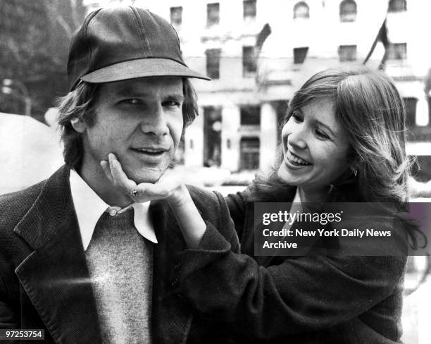 Harrison Ford and Carrie Fisher on Fifth Ave outside The Plaza hotel. They were in town for the movie "Star Wars."