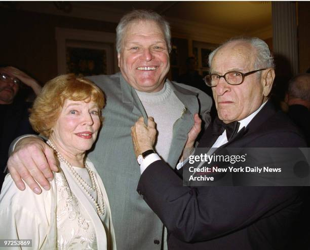 Eli Wallach sems to be getting tough with actor Brian Dennehy, who laughs off the threat while putting his arm around Wallach's wife, Anne Jackson,...