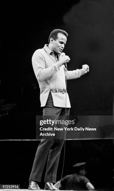 Harry Belafonte sings at McCarthy rally at Madison Square Garden.