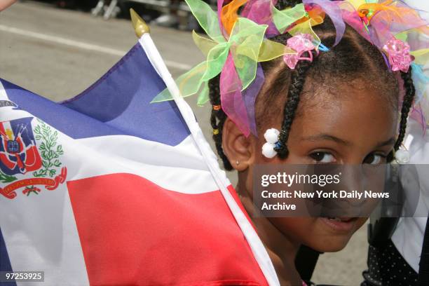 Elisa Maria Cose, 4 marches up Sixth Ave. As she participates in the 25th annual Dominican Day Parade.