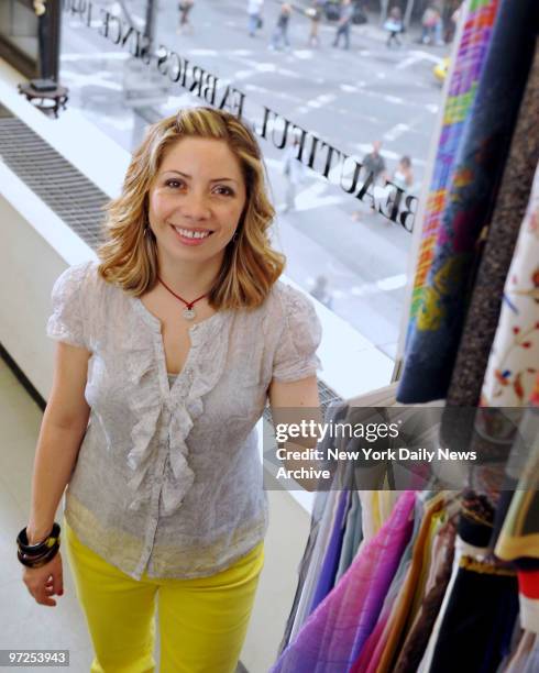 S Fabric Senior Buyer Laura Rios photographep at the famous fabric shop at 525 7th Avenue in Manhattan's Fashion Disrict. Rios is getting very busy...