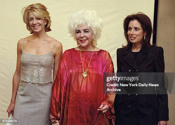Elizabeth Taylor is flanked by actress Natasha Richardson and Patricia Hambrecht, president of Christie's, at an American Foundation for AIDS...
