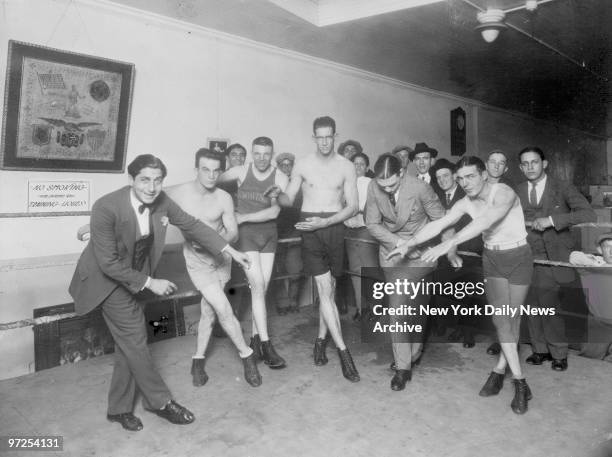 Harry Gelb, world's middleweight champion, shown second from right is doing the Charleston for foot work part of training.