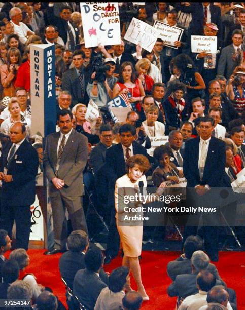 Elizabeth Dole, wife of Bob Dole, walks on the floor of the San Diego Convention Center on day three of the Republican National Convention Wednesday....