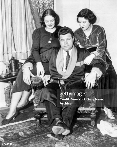 Babe Ruth relaxes at home with wife Claire and daughter Dorothy after recovering from flu.