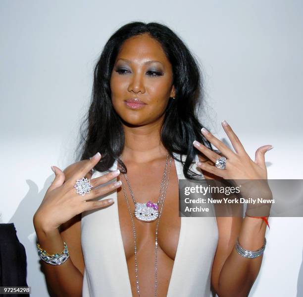 Baby Phat designer Kimora Lee Simmons displays some of the new jewelry she has created for her line, including a $50,000 diamond Hello Kitty pendant,...