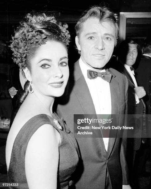 Elizabeth Taylor and Richard Burton enter a midtown nightclub for party after his opening on Broadway in "Hamlet" in which Burton play the title role.