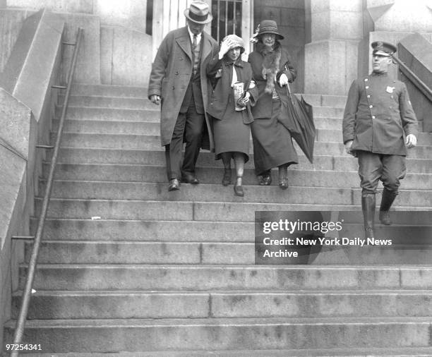 Back Into Life., After five and one-half years behind prison bars Celia Cooney, Brooklyn's first bobbed-hair bandit and her holdup husband, Edward,...