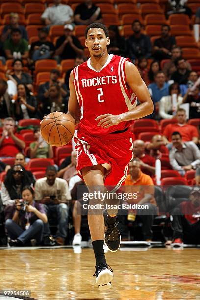 Garrett Temple of the Houston Rockets moves the ball up court during the game against the Miami Heat at American Airlines Arena on February 9, 2010...