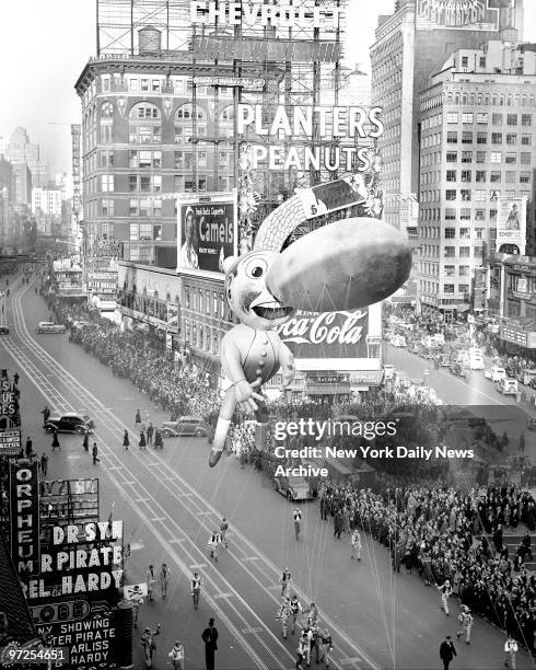 Pinocchio balloon floats down Broadway in thirteenth annual Macy's Thanksgiving Day parade. Seven musical organizations, twenty-one floats and...