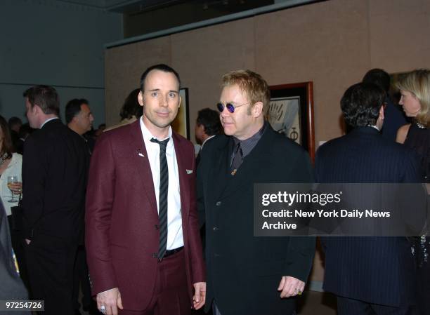 Elton John and David Furnish attend a benefit at Sotheby's to posthumously recognize photographer Herb Ritts for his work and activism. In honor of...