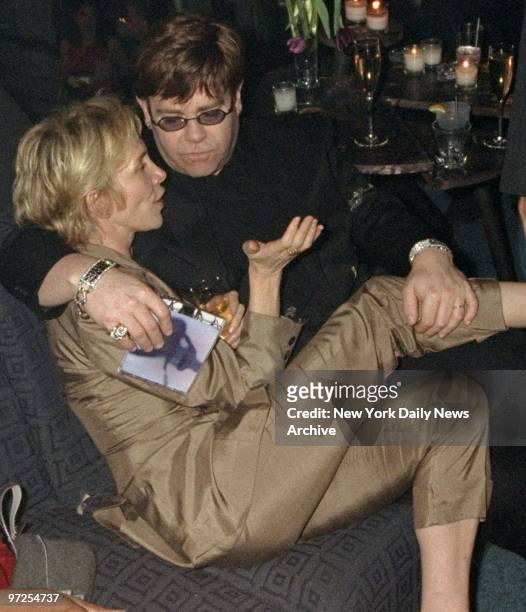 Elton John and Trudy Styler at party sponsored by Sean Combs and "Notorious" magazine.