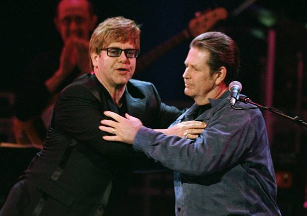 Elton John embraces the guest of honor at "An All-Star Tribute to Brian Wilson" at Radio City Music Hall.