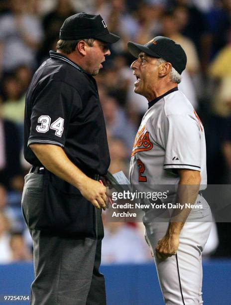 Baltimore Orioles' interim manager Sam Perlozzo yells at home plate umpire Sam Holbrook during the second inning of a game against the New York...