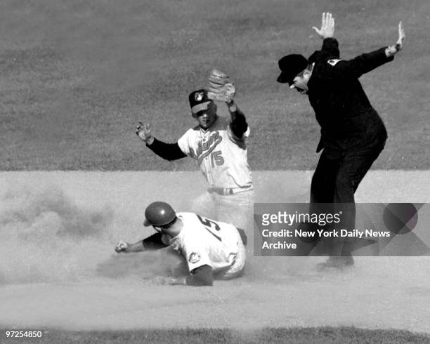 Baltimore Orioles second baseman Dave Johnson makes tag to late and N.Y. Mets Jerry Grote slides safely into second with a double in Game 4 of the...