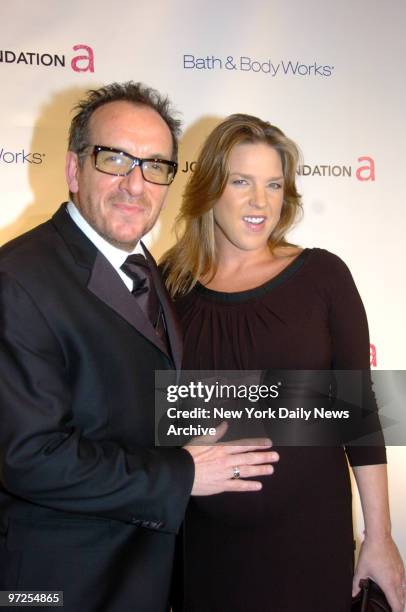 Elvis Costello and wife Diana Krall, expecting twins this December, are at the Waldorf-Astoria hotel for The Elton John AIDS Foundation's fifth...