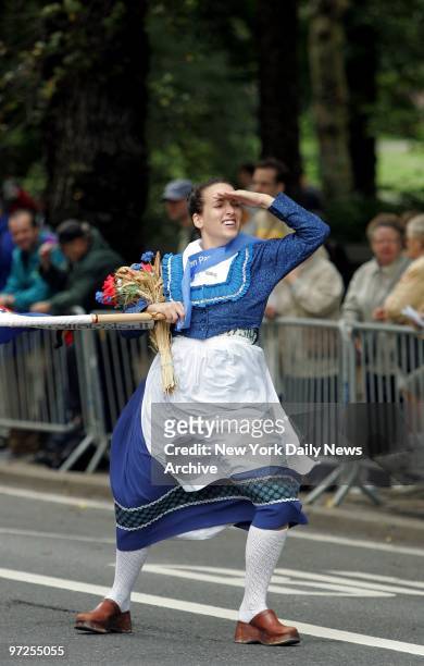 Heather Marold of Brooklyn is nearly blown away by the high winds of Hurricane Ivan as she marches in the 47th annual German-American Steuben Parade...