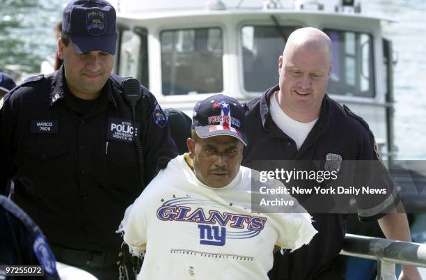 Ernesto DeJesus is removed from a police boat after he was taken into custody in Staten Island. He was charged with assault in the slashing of a...