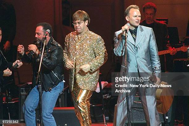 Billy Joel, Elton John and Sting performing at a Carnegie Hall benefit concert for the Rain Forest Foundation International.