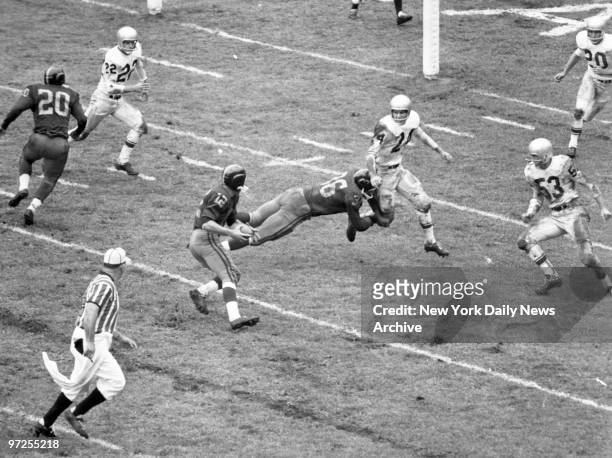 Block and Tackle, New York Titan quarterback Al Dorow moves for yardage on second-period rollout as teammate Dewey Bohling puts key block on Buffalo...
