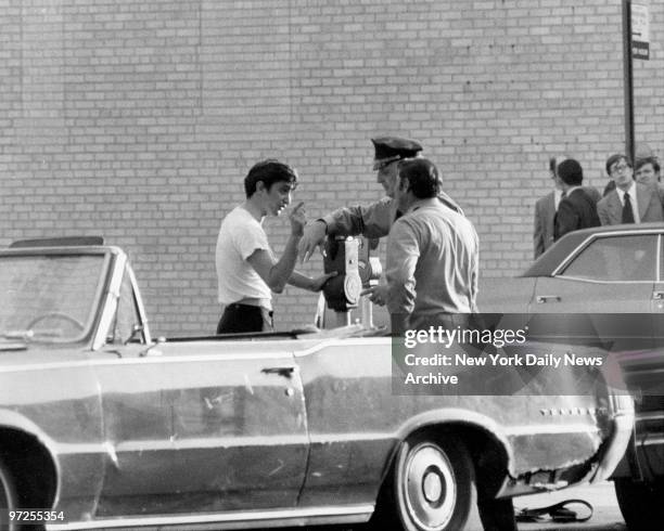 Bank robber John Wojtowicz, comes out of Chase Manhattan branch at 450 Avenue P in Bensonhurst, Brooklyn to talk to police.