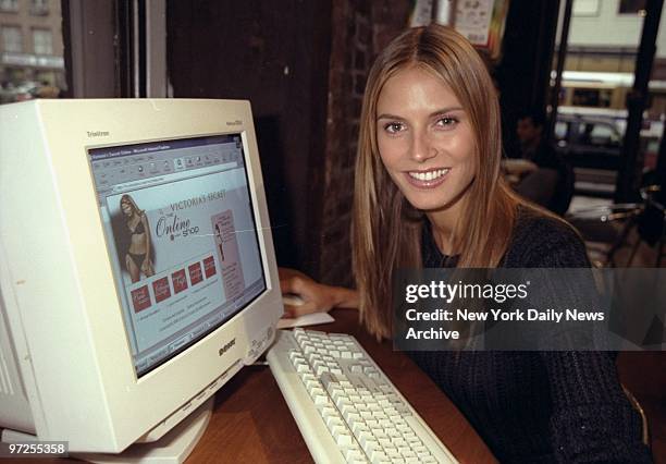 Heidi Klum checking out the Victoria's Secret web site at the Cyber Space cafe.