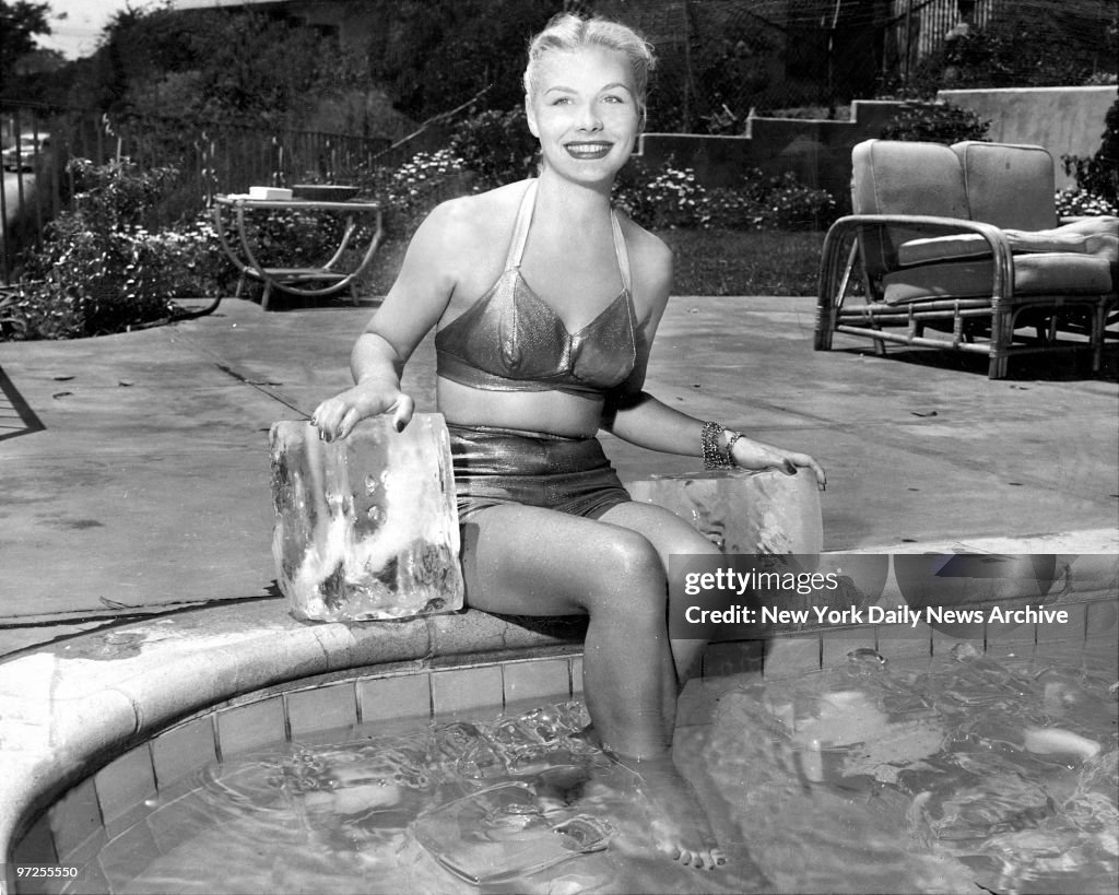 Barbara Payton, displaying her charm midst some cooling cube