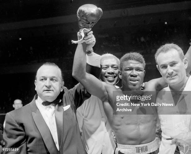 Emile Griffith vs Benny Paret, Benny Paret lies helpless against ropes as flailing fists of Emile Gfriffith batter him into unconsciousness during...