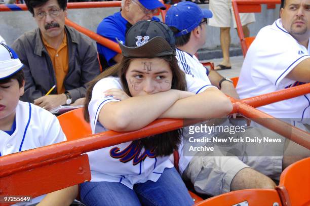 Emily Losordo of Hoboken, N.J., is visibly dejected along with other New York Mets fans during a game between the Mets and the Florida Marlins at...