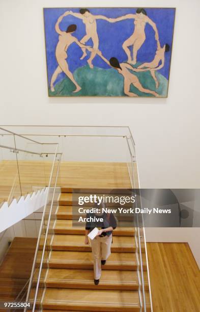 Henri Matisse's "Dance" hangs over a staircase at the newly renovated Museum of Modern Art, which reopens at its old E. 53rd St. Location this...