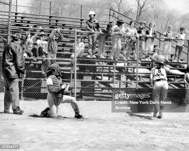 Baseball Little League Bitsy Osder slams down bat after whiffing her first time up in 1st inning and she doesn't like it on bit and she lets the...