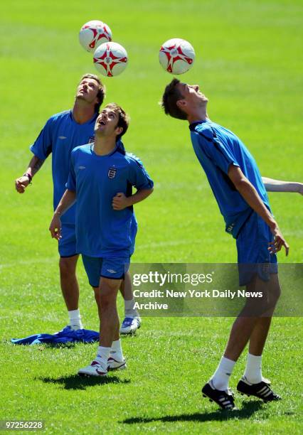English soccer players David Beckham, Joe Cole and Peter Crouch of the England National Team practice at Giants Stadium for their Tuesday match...