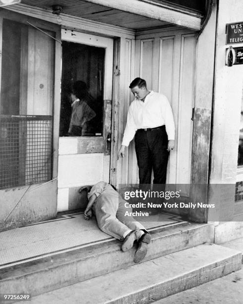 Herbert Johnson and Howard Flood, witnesses to the Denhardt murder, re-enact the murder scene at the Armstrong Hotel.