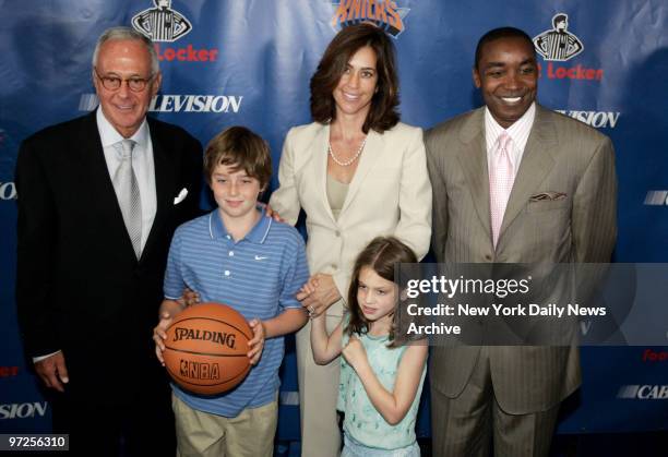 Basketball Hall of Famer Larry Brown, wife Shelly and New York Knicks' president Isiah Thomas stand with Brown's children - son L.J. And daughter...
