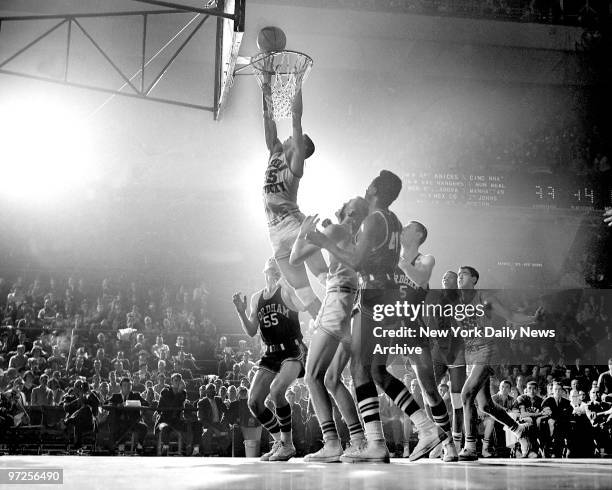 Highlights Of Court Battles..., Head and shoulders above the crowd, Western Kentucky's Dwight Smith soars to dunk two points during afternoon...