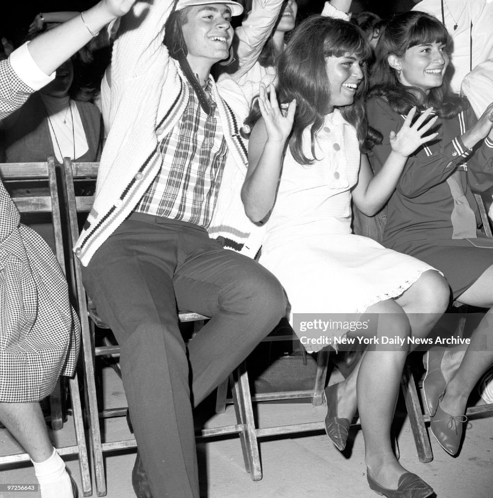 Beatle fans enjoy music and singing of their four heroes at