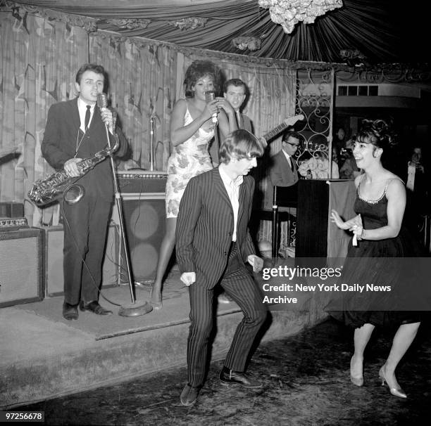 Beatles drummer Ringo Starr lets another group do the performing as he dances with Jeanie Dell, a singer at the Headline Club, a few days after the...