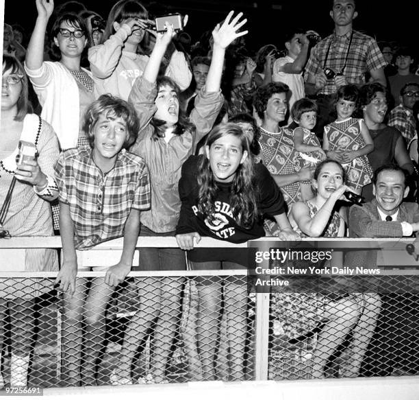 Beatles fans at Shea Stadium register varying emotions during last night's moptop concert.