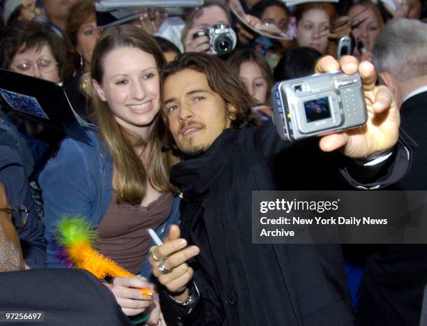 Enthusiastic fan lives it up as actor Orlando Bloom poses with her at premiere screening of "Kingdom of Heaven" at the Ziegfled Theater on 54th St....