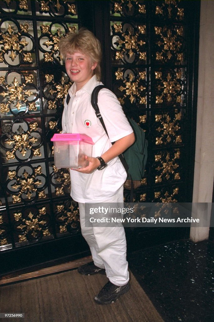 Eric Trump arrives home from school with his pet hamster, Co