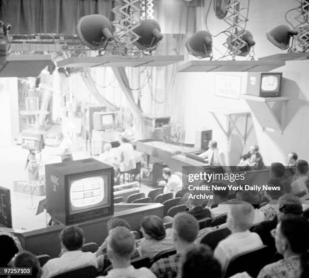 Behind the scenes of NBC's "Tic Tac Dough" quiz show hosted by Jack Barry.Audience at NBC's New York studio have to crane necks to see show as it's...