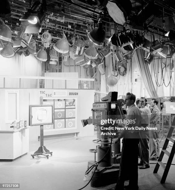 Behind the scenes of NBC's "Tic Tac Dough" quiz show hosted by Jack Barry.Technicians sight cameras on test pattern. Note the many overhead lights...