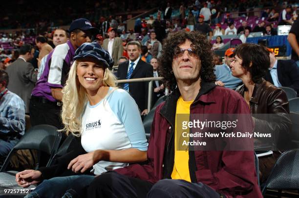 Howard Stern and girlfriend Beth Ostrosky attend a game between the New York Knicks and the Washington Wizards at Madison Square Garden. The Wizards...