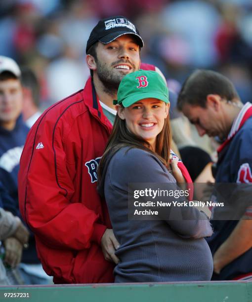 Ben Affleck and wife Jennifer Garner, who's expecting their first child, are on hand to cheer on the Boston Red Sox during a game against the New...